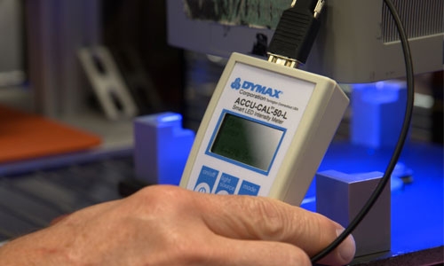 Using a radiometer to calibrate a flood light-curing lamp.