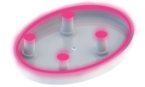 An exploded diagram of the bottom of a medical wearable device and the areas Dymax adhesives is used to assemble components.